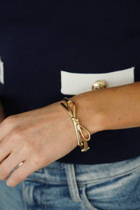 Karina Bow Wrapped Hinge Bangle in Gold